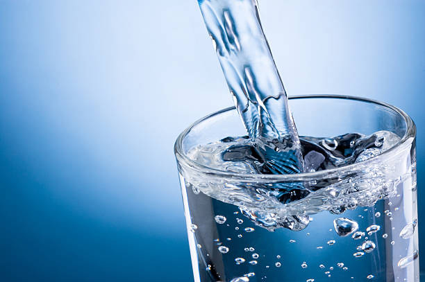 As theaPouring water into glass on blue background most popular filtration method, reverse osmosis can not be ignored. With the help of a semi-permeable membrane, reverse osmosis can remove most of impurities of water. It is efficient, energy-saving and environmentally-friendly filtration technology, which has been widely applied to commercial, industrial and residential uses.